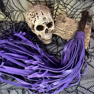 The Purple B*stard leather flogger with reclaimed walnut handle