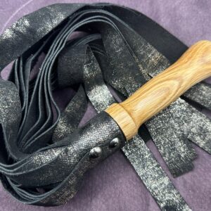 Sparkle Black leather flogger with hand-turned handle.