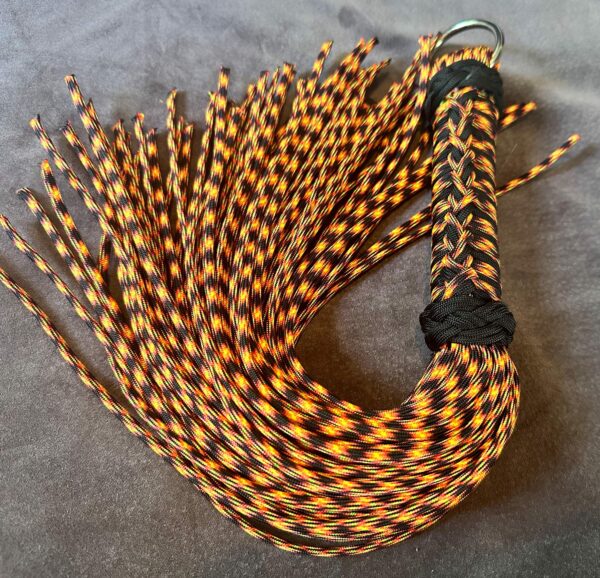 UV Lave Flow- UV Orange and Black Paracord Flogger