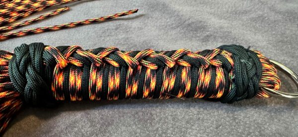 UV Lave Flow- UV Orange and Black Paracord Flogger - Image 7