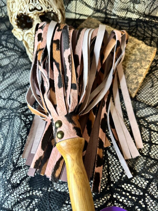 Pink hair on leopard hide with dusky mauve leather flogger with hand turned handle - Image 3