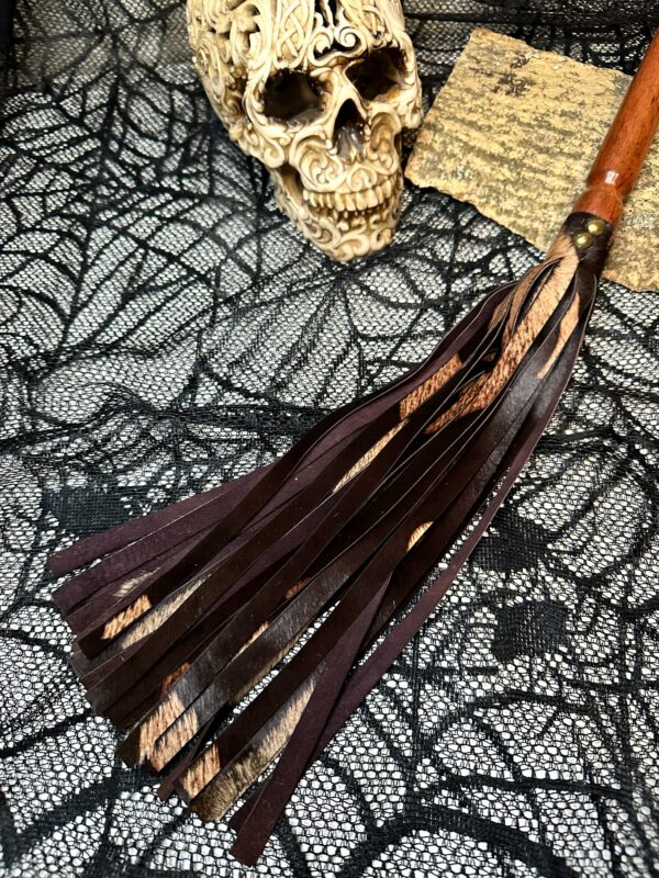 Two-tone brown hair-on-hide flogger with hand-turned handle - Image 2