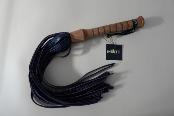 Oak handled flogger with a dark purple grain print leather