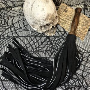 Thick black suede and black leather flogger