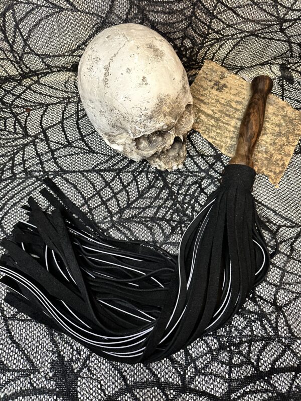 Thick black suede and black leather flogger