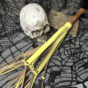 Sadistic Sunshine texture fueled leather flogger with hand-turned handle