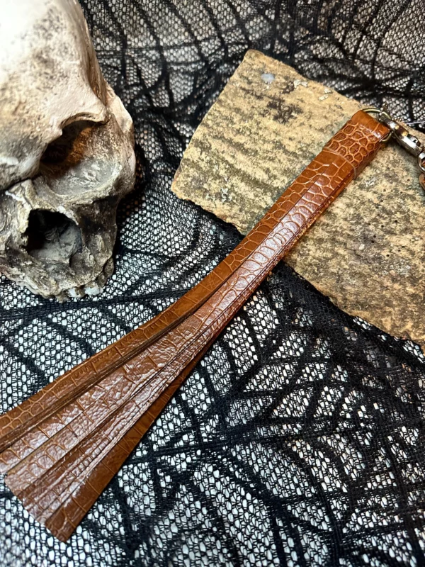 Whiskey coloured embossed leather pussy/dick flogger