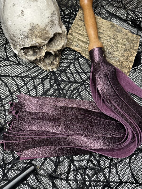 The Amethyst Love metallic purple leather flogger with hand turned handle