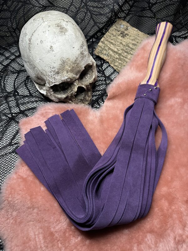 Proud Purple suede flogger with purple accent hand-turned handle.