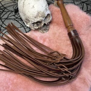 The Buffalo B*astard Tawse leather flogger with hand turned handle