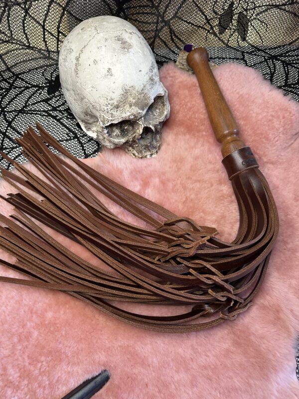 The Buffalo B*astard Tawse leather flogger with hand turned handle