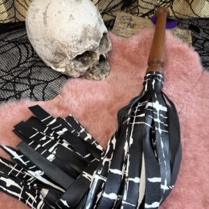 Black with white print calfskin flogger