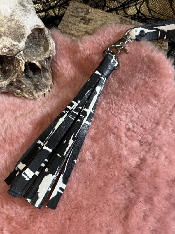 Black with white print calfskin pussy/dick flogger