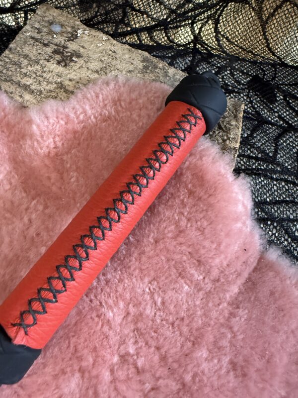 Rubber Whip with red leather wrapped handle and black stitching - Image 4