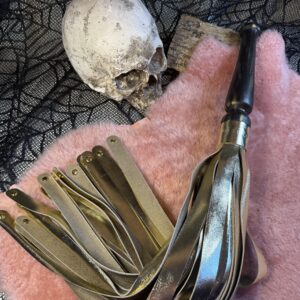 The Golden One flogger with studded falls