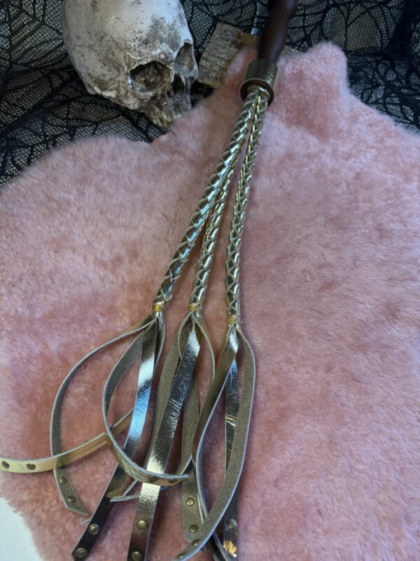 The Triple Whipped Gold flogger