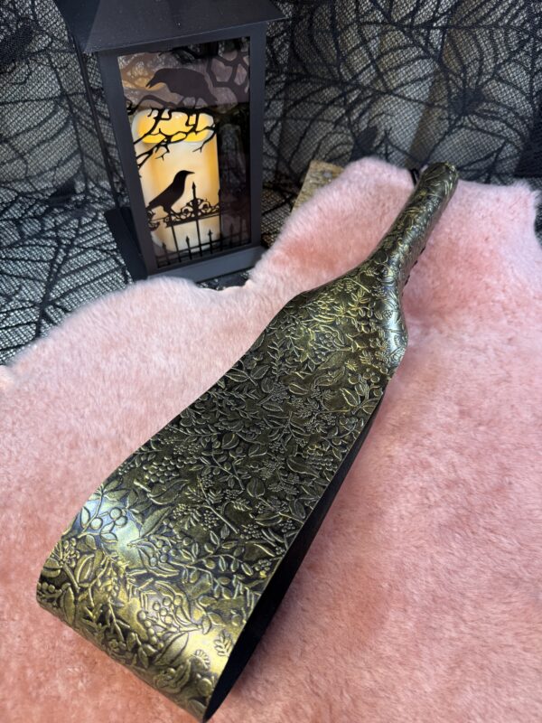Black and Gold embossed leather belt-style paddle