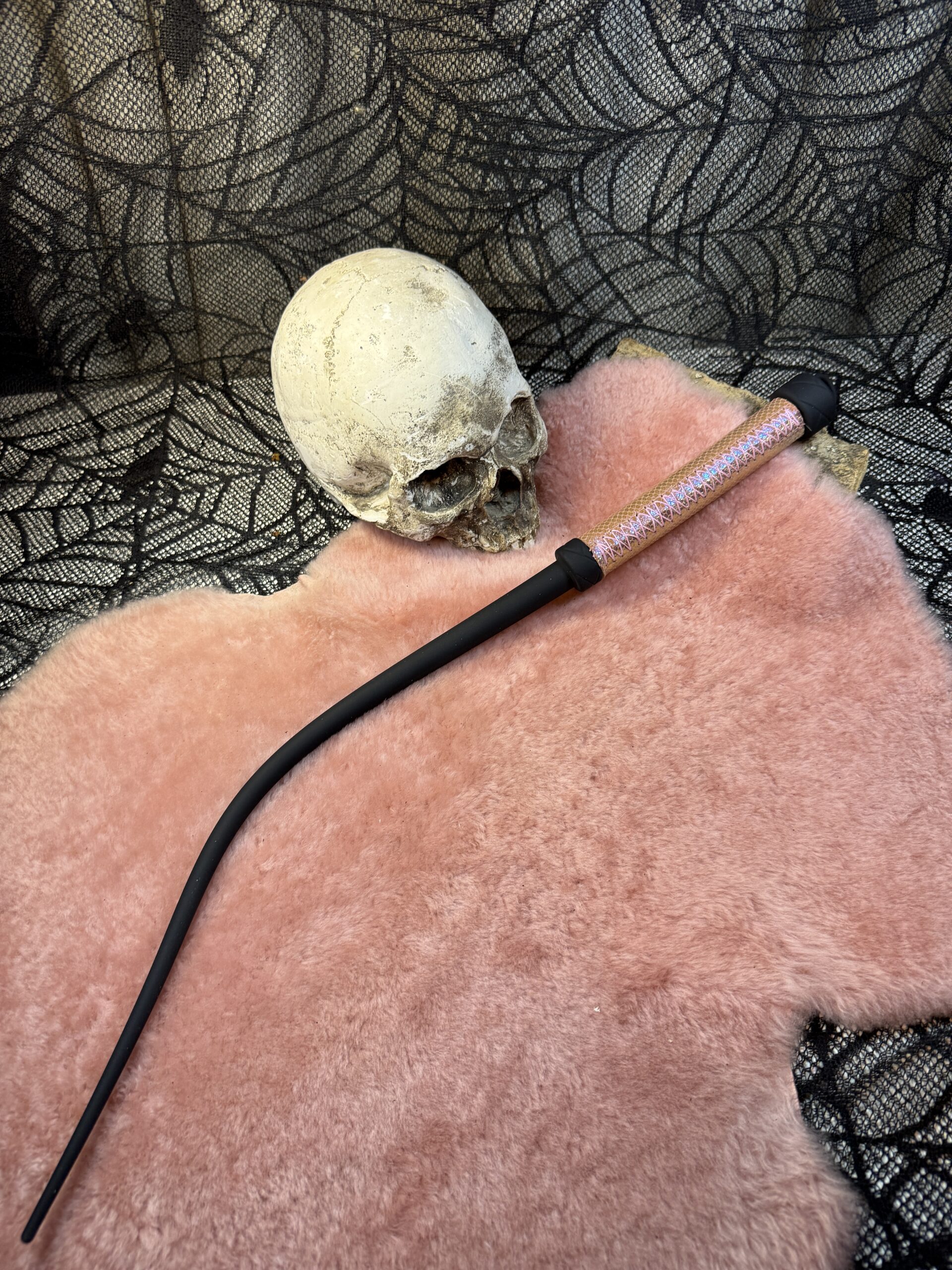 Holographic leather wrapped handle rubber whip