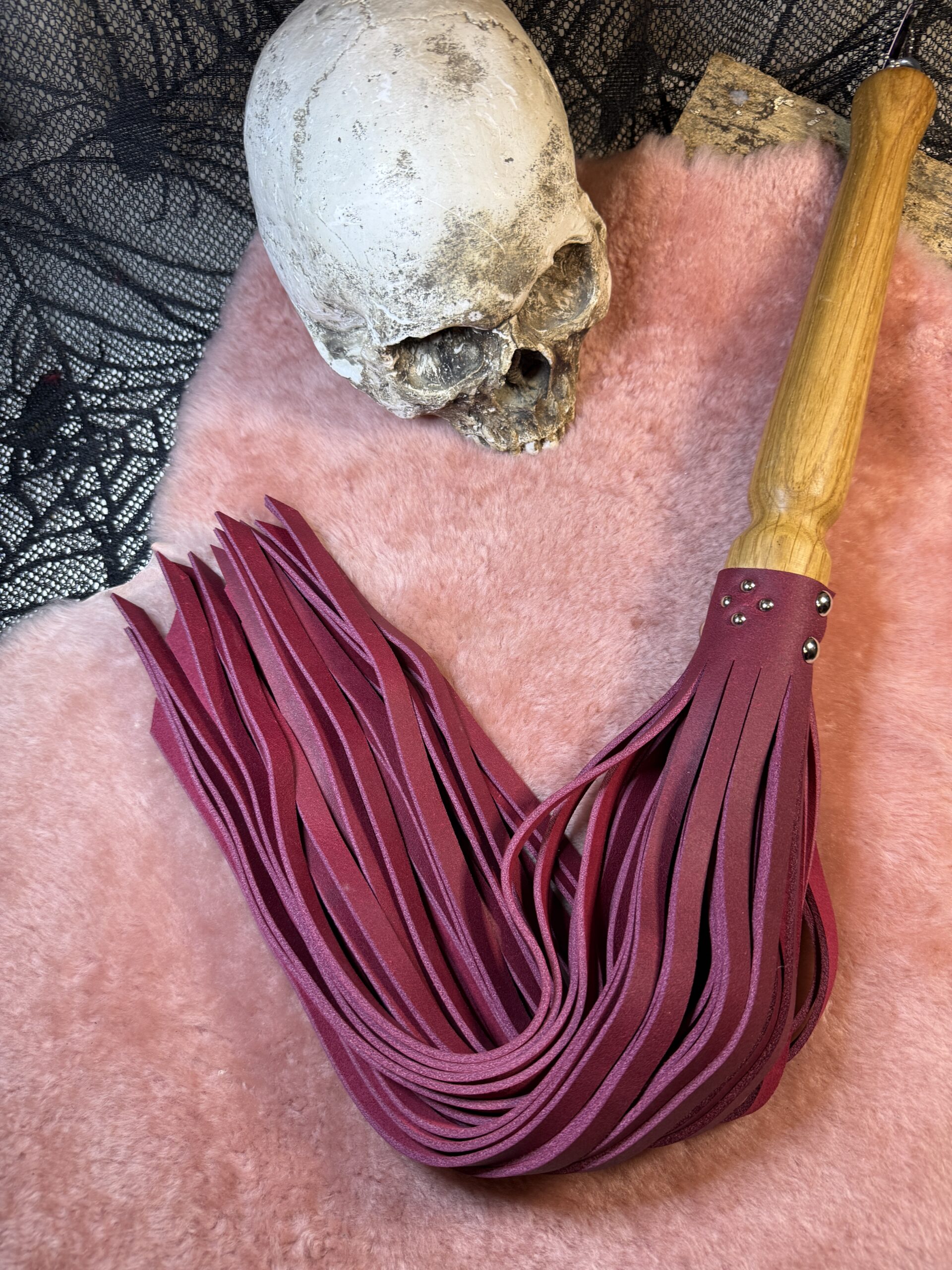The Crimson Tempest flogger with hand turned handle